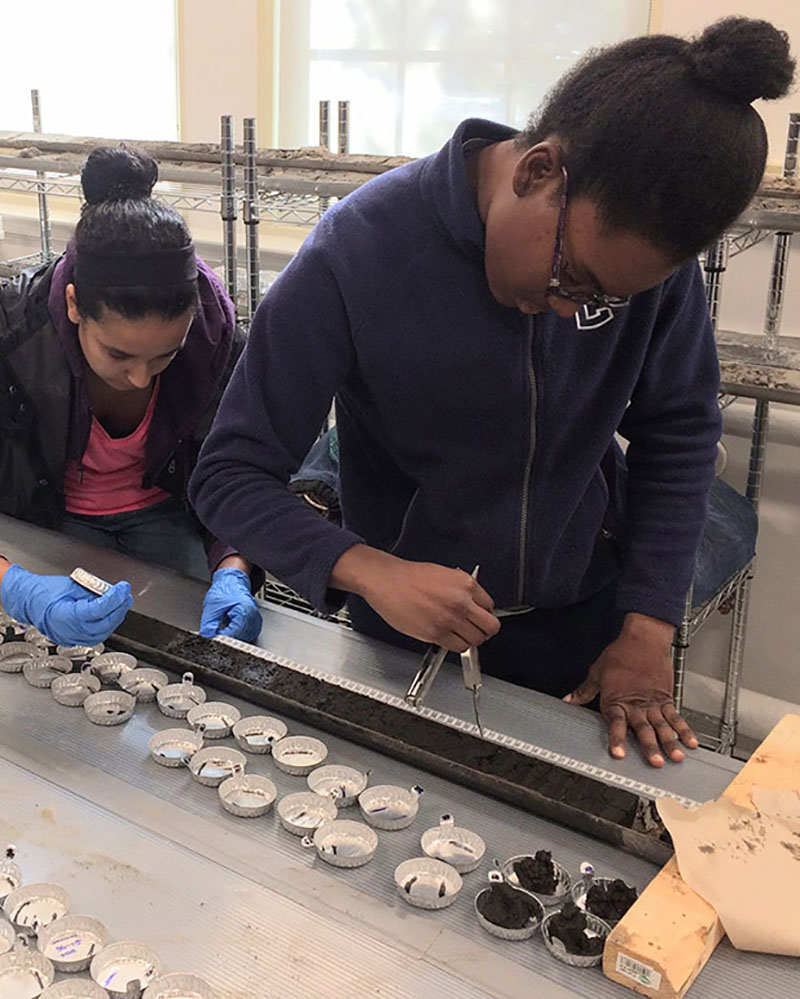 Undergrads working on a sediment core